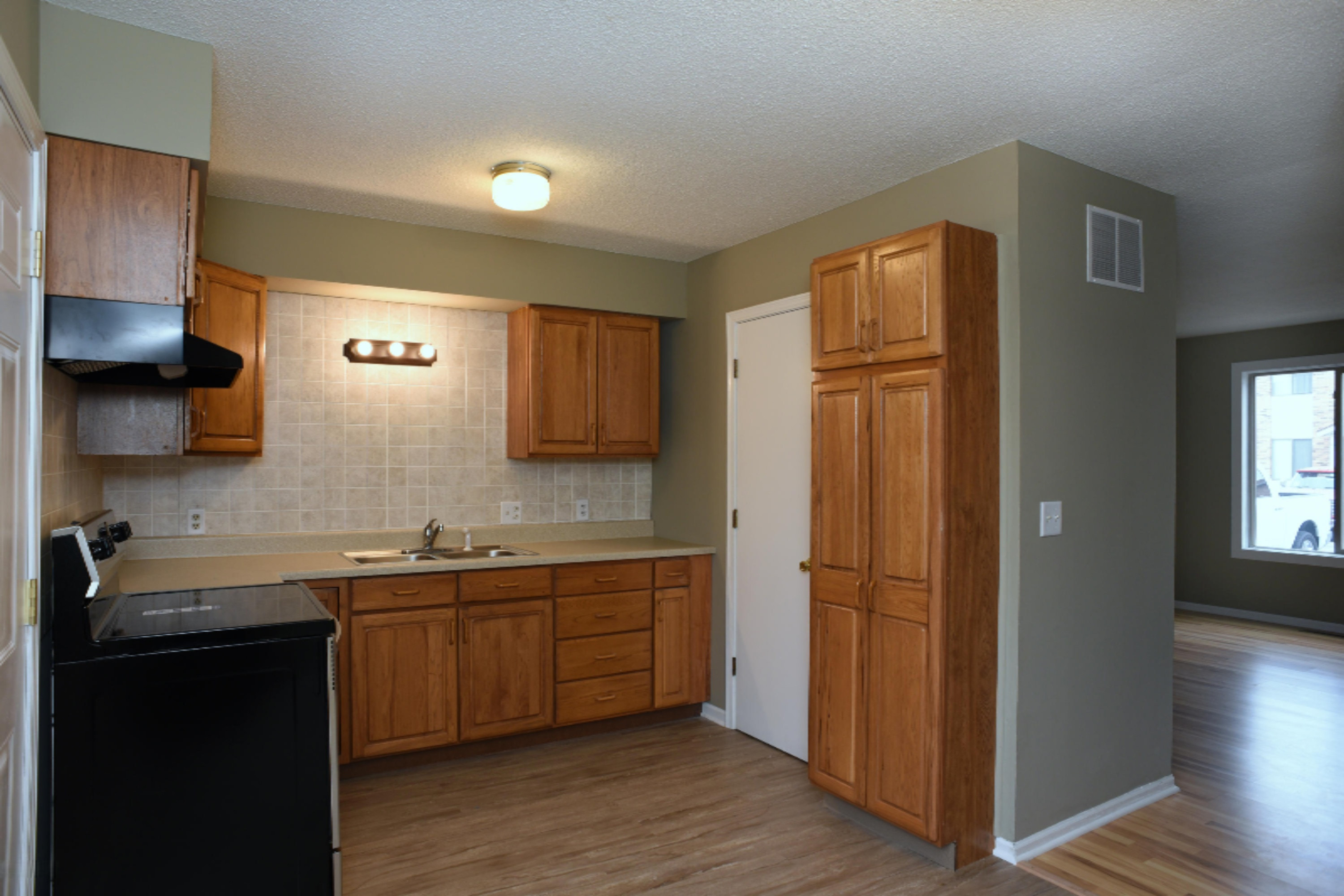 305 Riley Street, Unit 8 Holland, MI 49424 - Photo 4 of 14 _ Kitchen to living