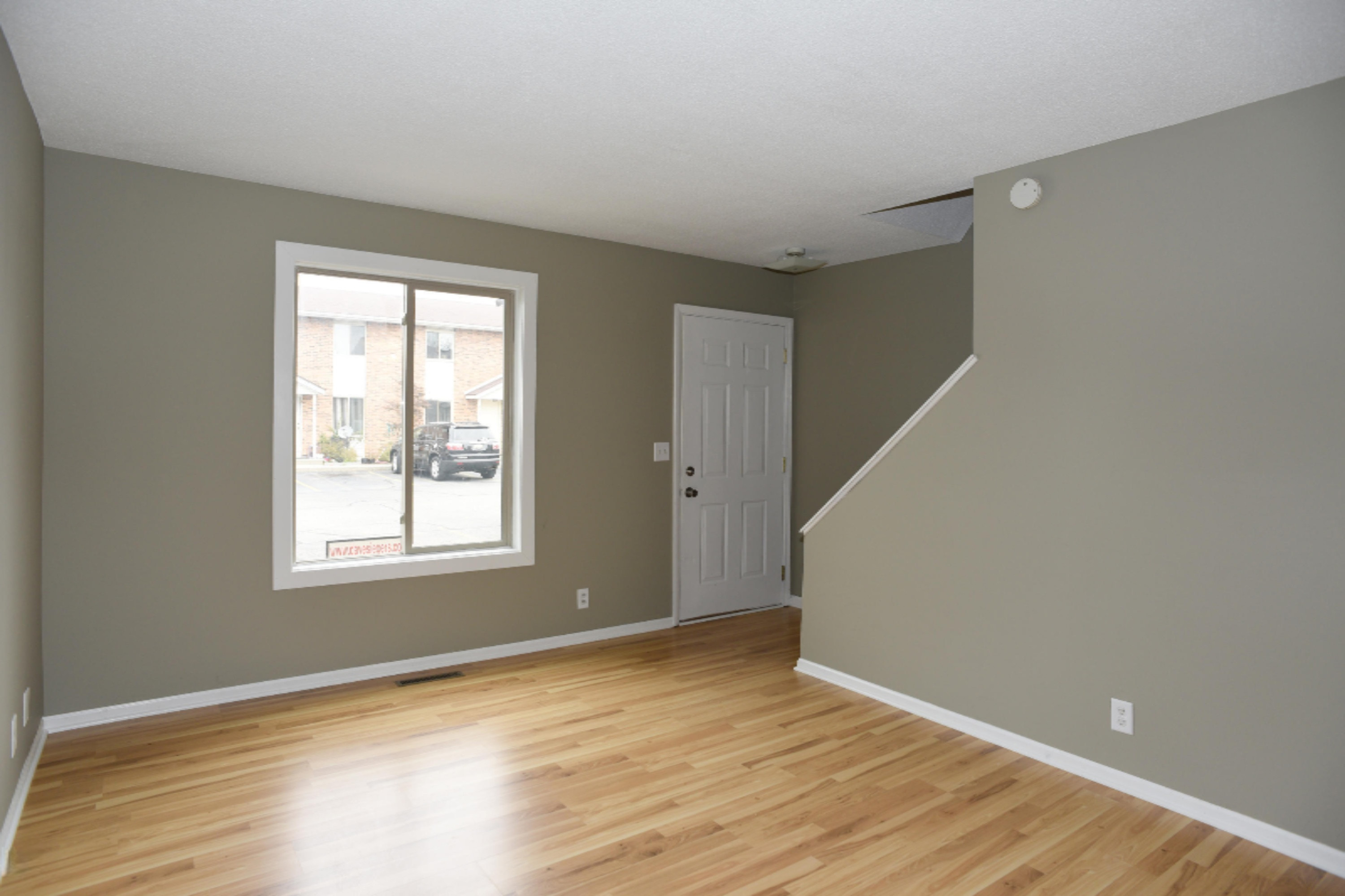 305 Riley Street, Unit 8 Holland, MI 49424 - Photo 6 of 14 _ living room stairs
