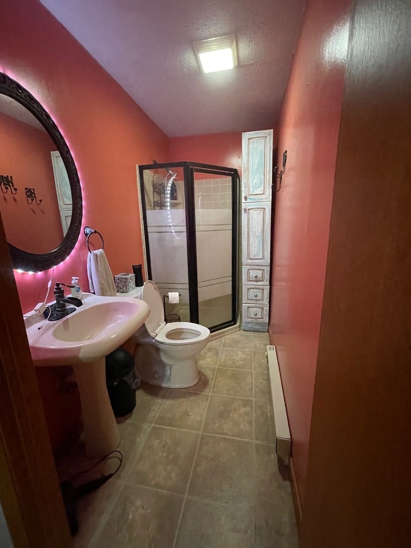 382 Keigwin Road Walnut, IL 61376 - Photo 27 of 49 a bathroom with a sink and mirror