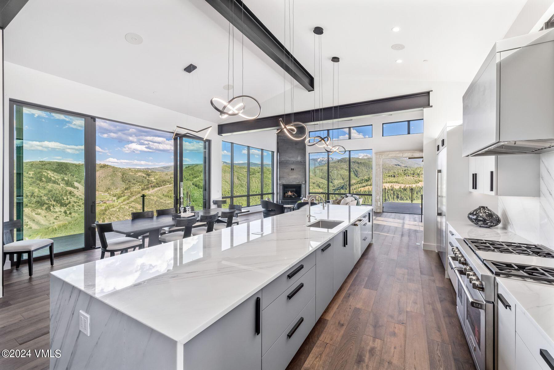 636 Saddle Ridge Loop Edwards, CO 81632 - Photo 17 of 46 a large kitchen with kitchen island a large window in it