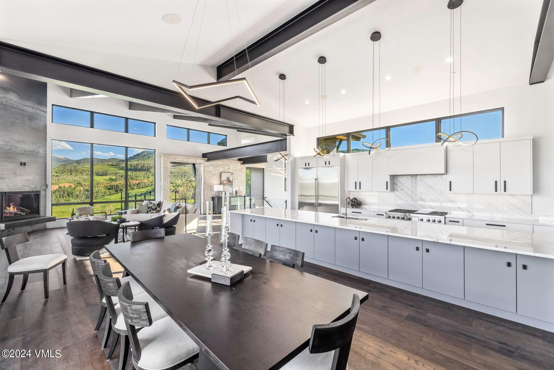 636 Saddle Ridge Loop Edwards, CO 81632 - Photo 24 of 46 a kitchen with center island wooden floor and stainless steel appliances