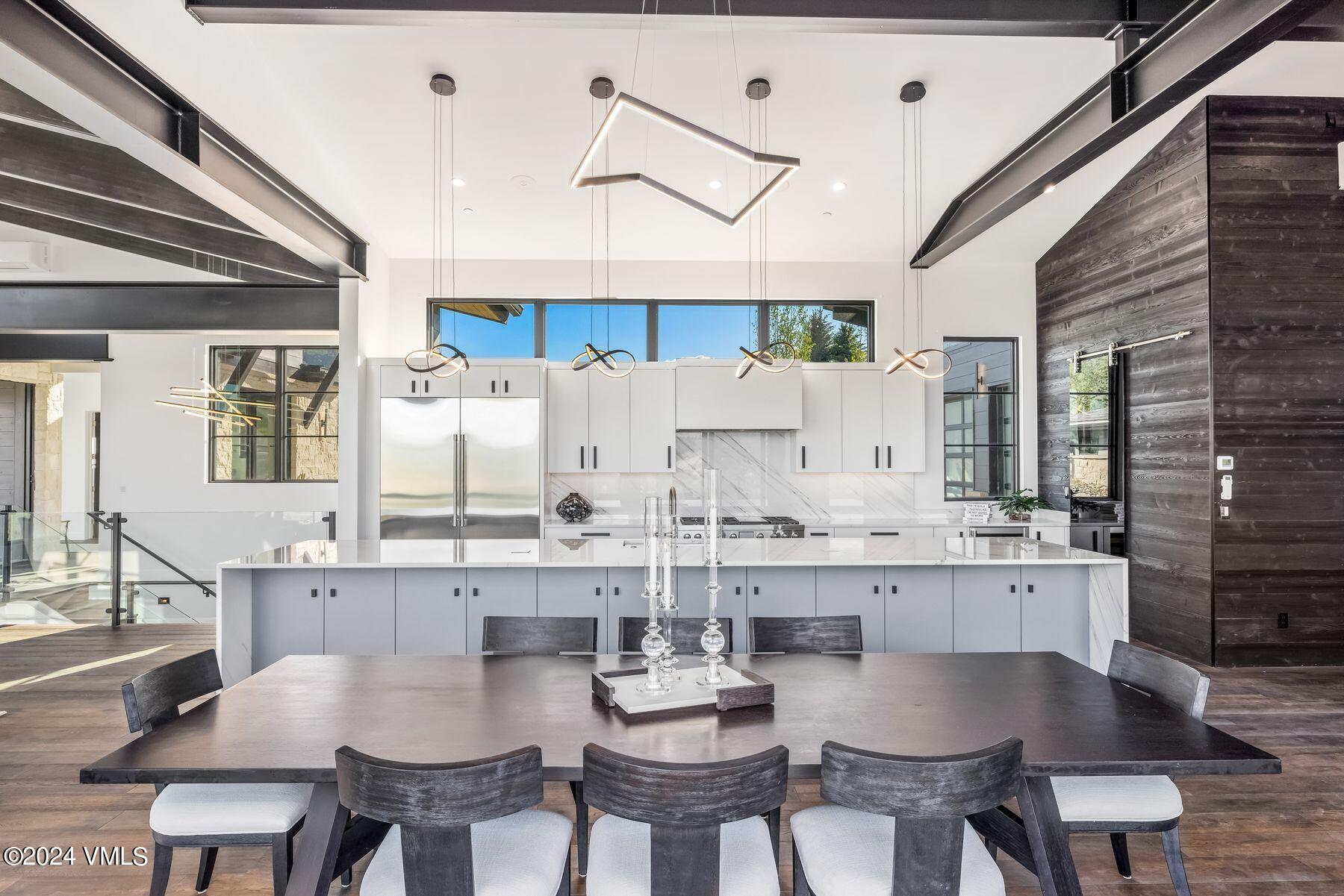 636 Saddle Ridge Loop Edwards, CO 81632 - Photo 25 of 46 a view of a dining room with furniture and wooden floor