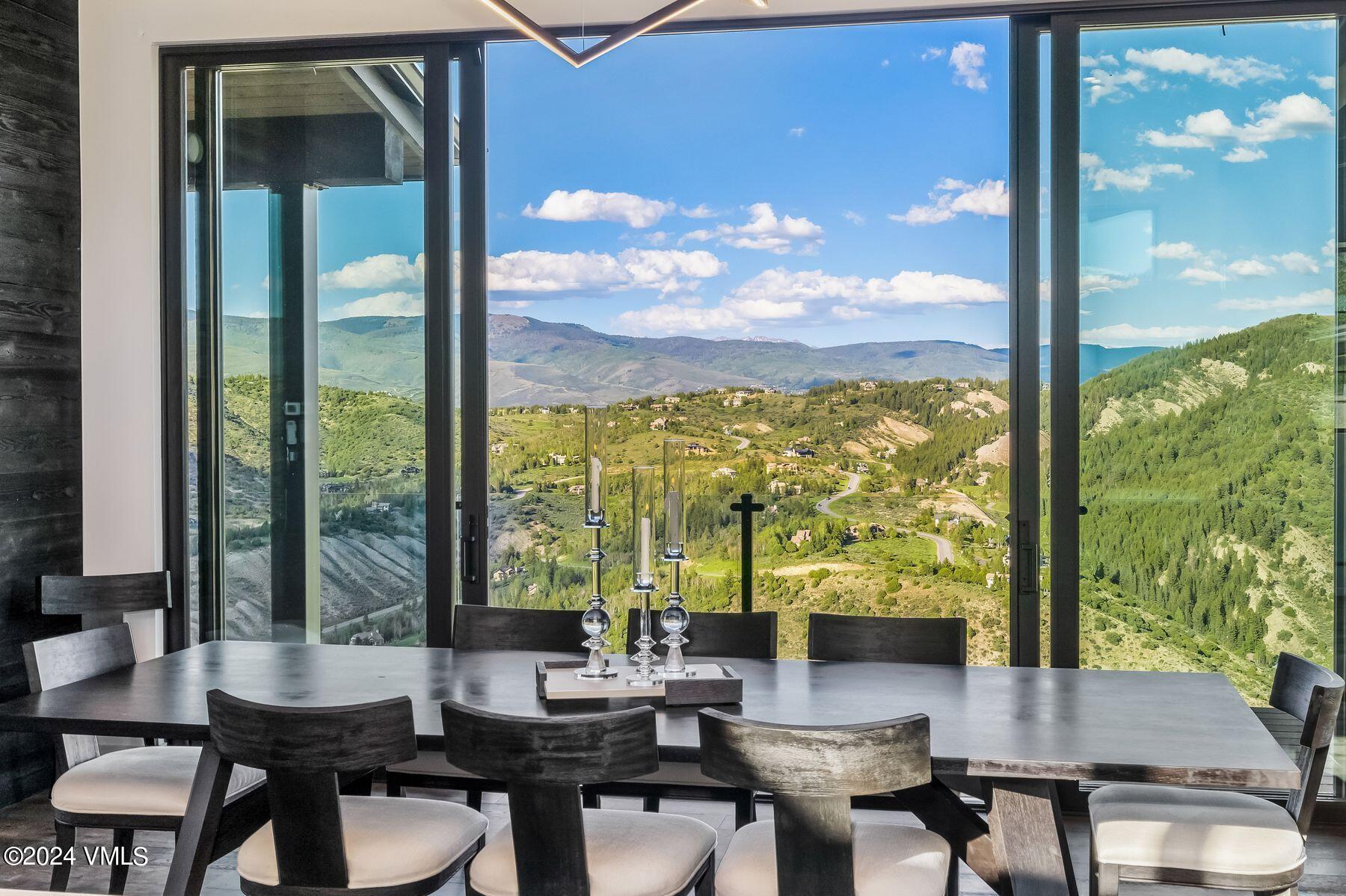636 Saddle Ridge Loop Edwards, CO 81632 - Photo 27 of 46 a view of a patio with dining table and chairs