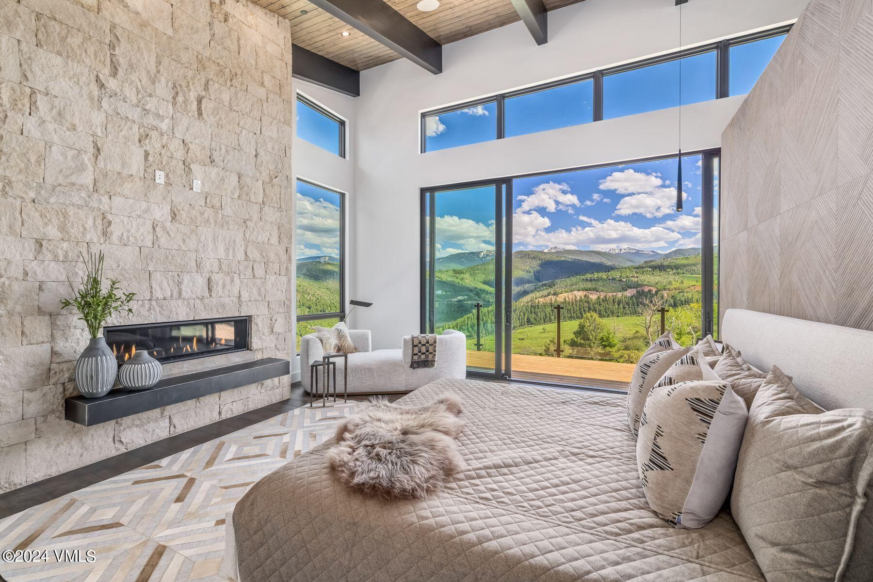 636 Saddle Ridge Loop Edwards, CO 81632 - Photo 28 of 46 a living room with furniture large windows and wooden floor