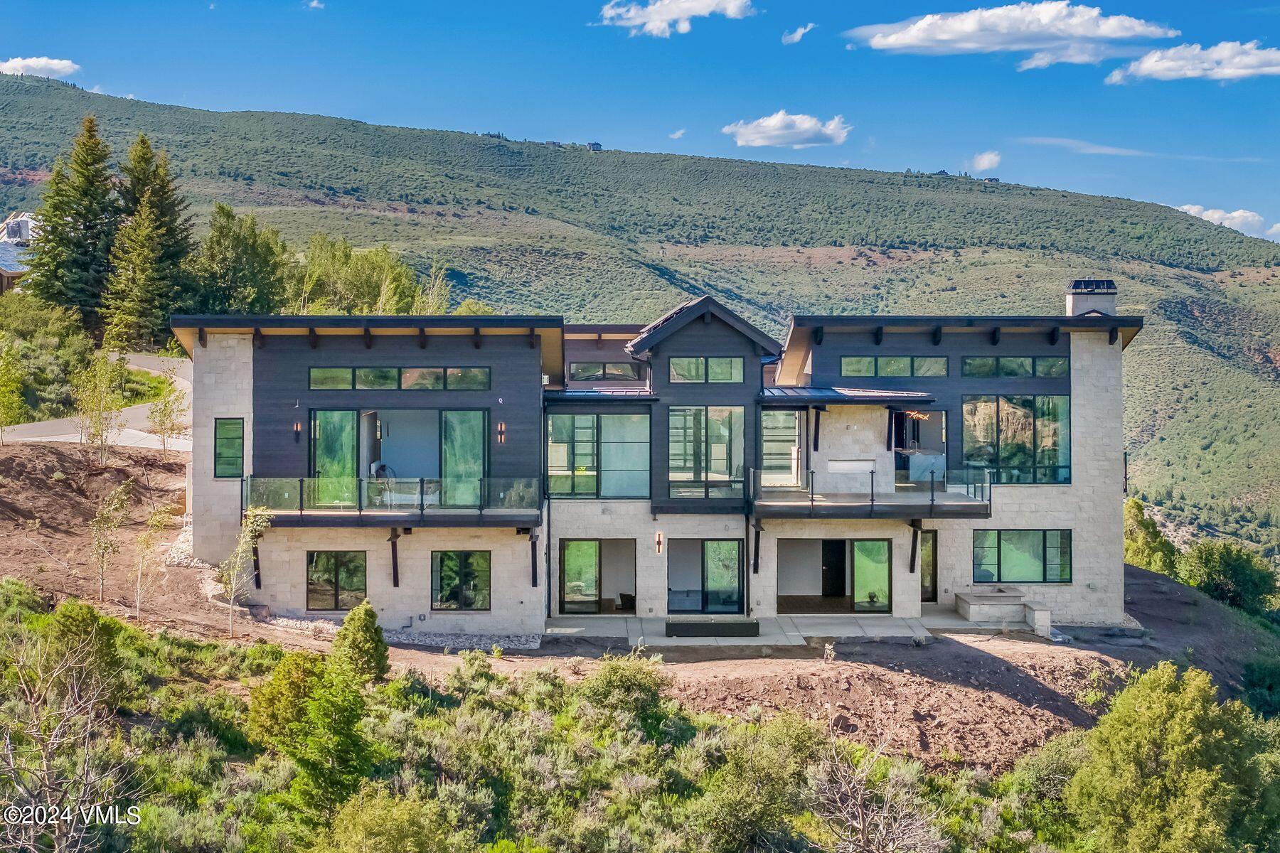 636 Saddle Ridge Loop Edwards, CO 81632 - Photo 36 of 46 front view of a building with a garden