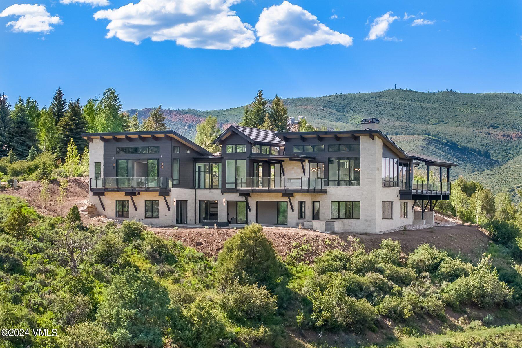 636 Saddle Ridge Loop Edwards, CO 81632 - Photo 37 of 46 an aerial view of a house with a big yard and potted plants