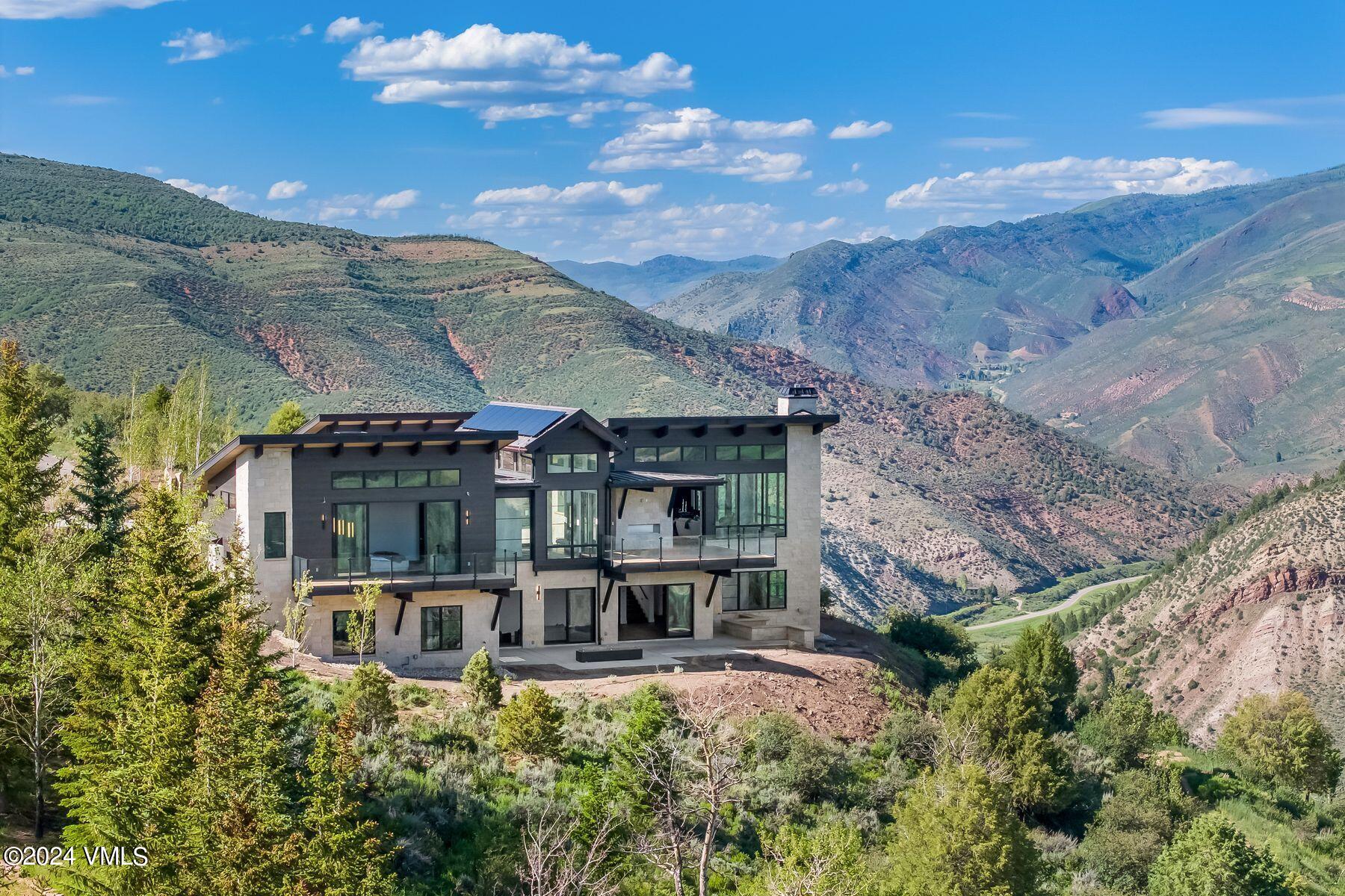 636 Saddle Ridge Loop Edwards, CO 81632 - Photo 38 of 46 a front view of a house with a yard