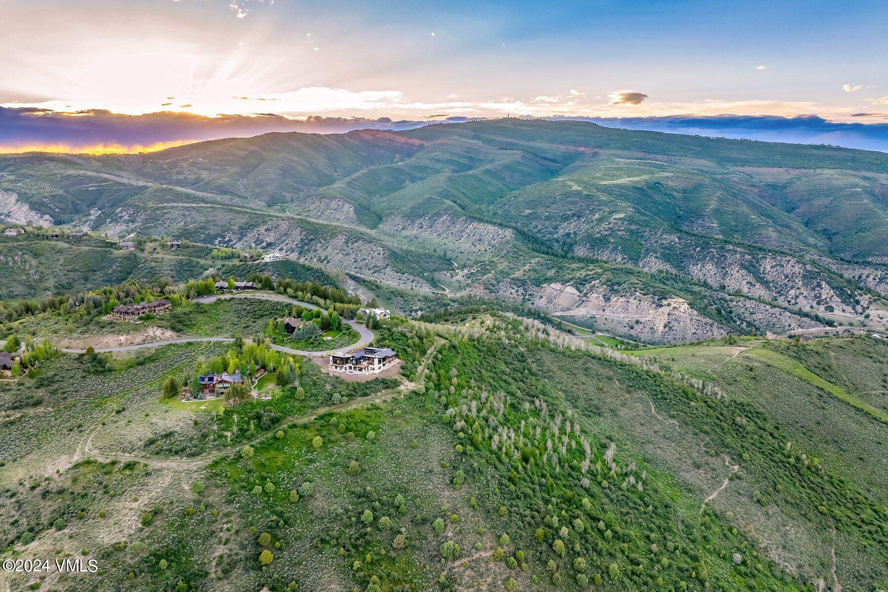636 Saddle Ridge Loop Edwards, CO 81632 - Photo 44 of 46 a view of a lush green hillside and houses