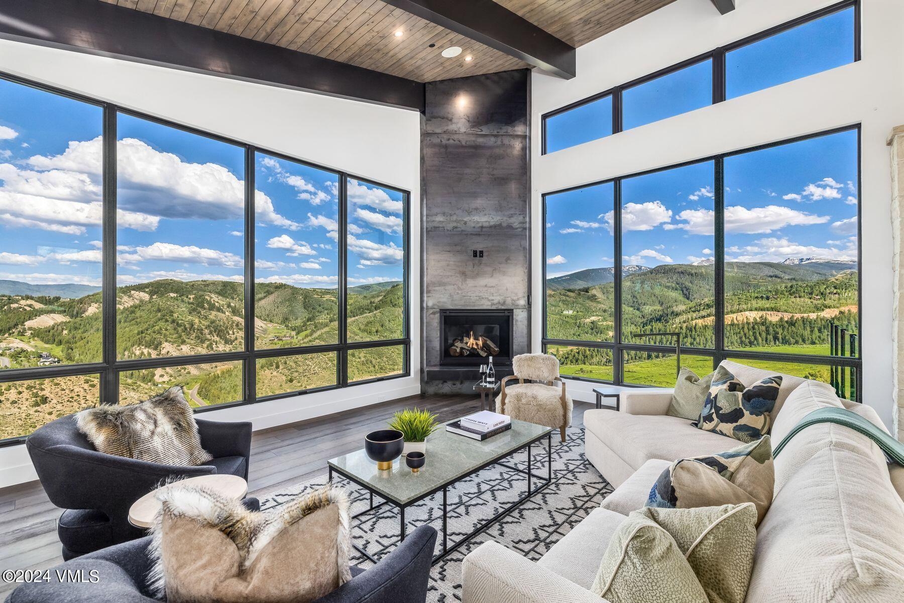 636 Saddle Ridge Loop Edwards, CO 81632 - Photo 5 of 46 a living room with furniture and a large window