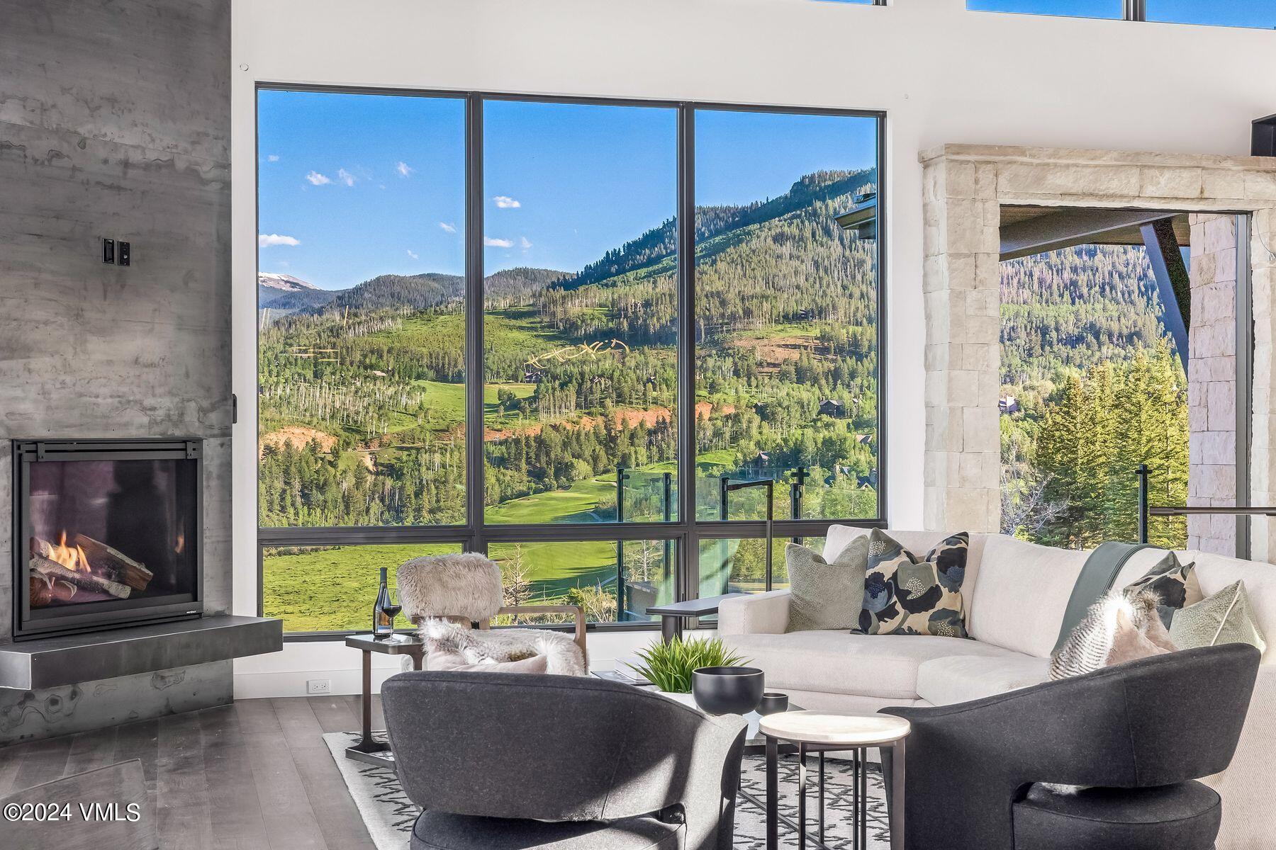 636 Saddle Ridge Loop Edwards, CO 81632 - Photo 8 of 46 a living room with furniture and a floor to ceiling window