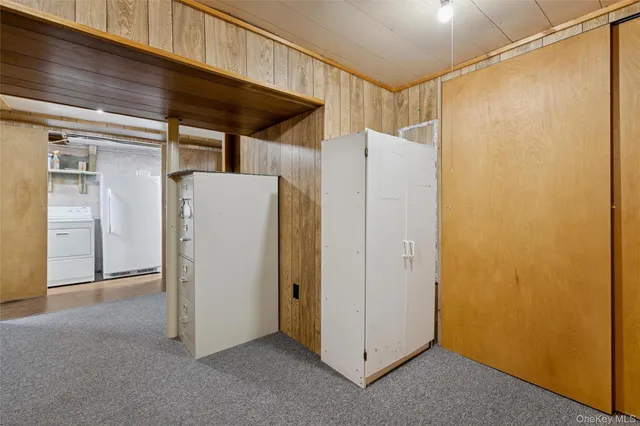 a view of backyard with fountain plants and large trees