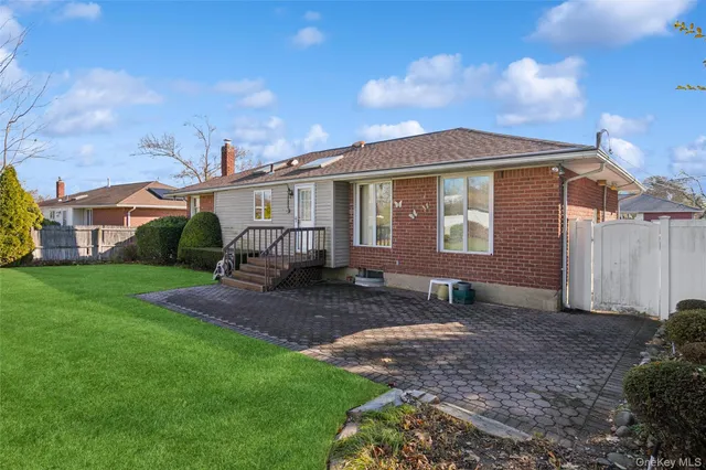a front view of house with yard and green space
