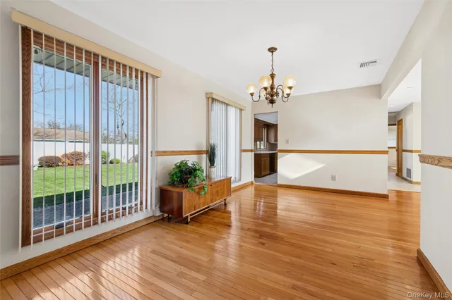 a view of a living room and kitchen with a large window