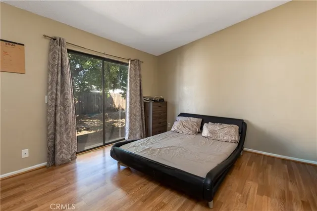 a living room with a bed furniture and a large window