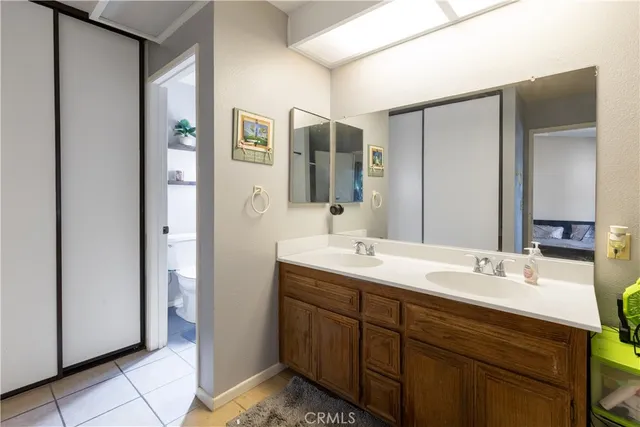 a bathroom with a double vanity sink and mirror