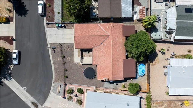 aerial view of a house with pool and sitting area