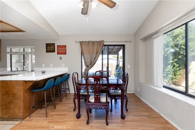 a view of a dining room with furniture and window