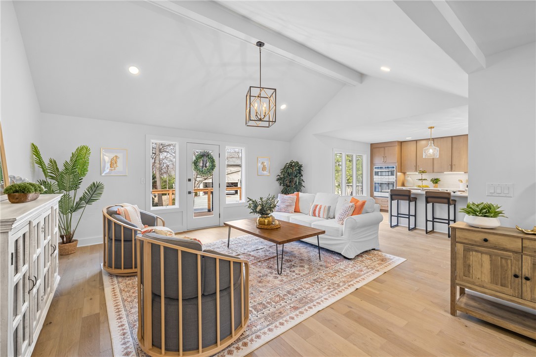 117 Riverpoint Drive Clemson, SC 29631 - Photo 9 of 47 This airy open-concept living area seamlessly connects to a modern kitchen, creating an inviting gathering space.