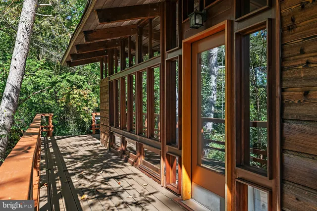 a view of balcony with wooden floor