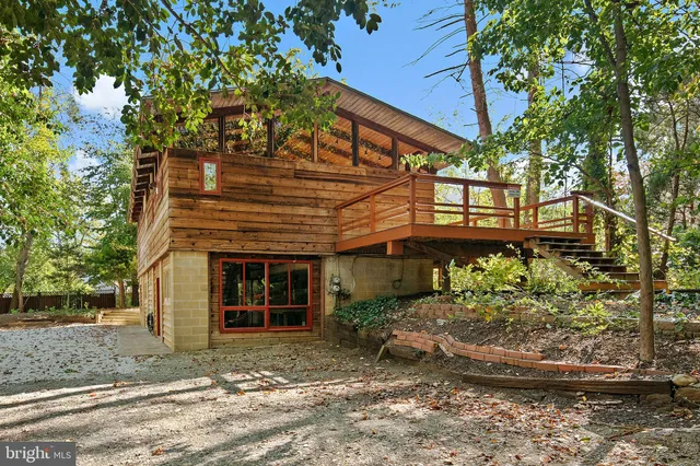 a view of balcony with wooden floor and fence