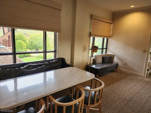 a kitchen with a table and chairs
