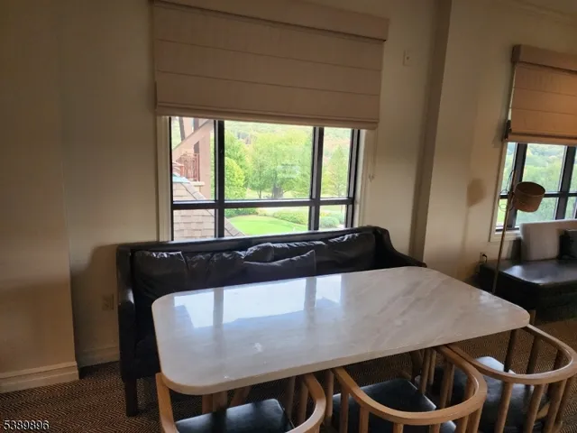 a kitchen with a table and chairs