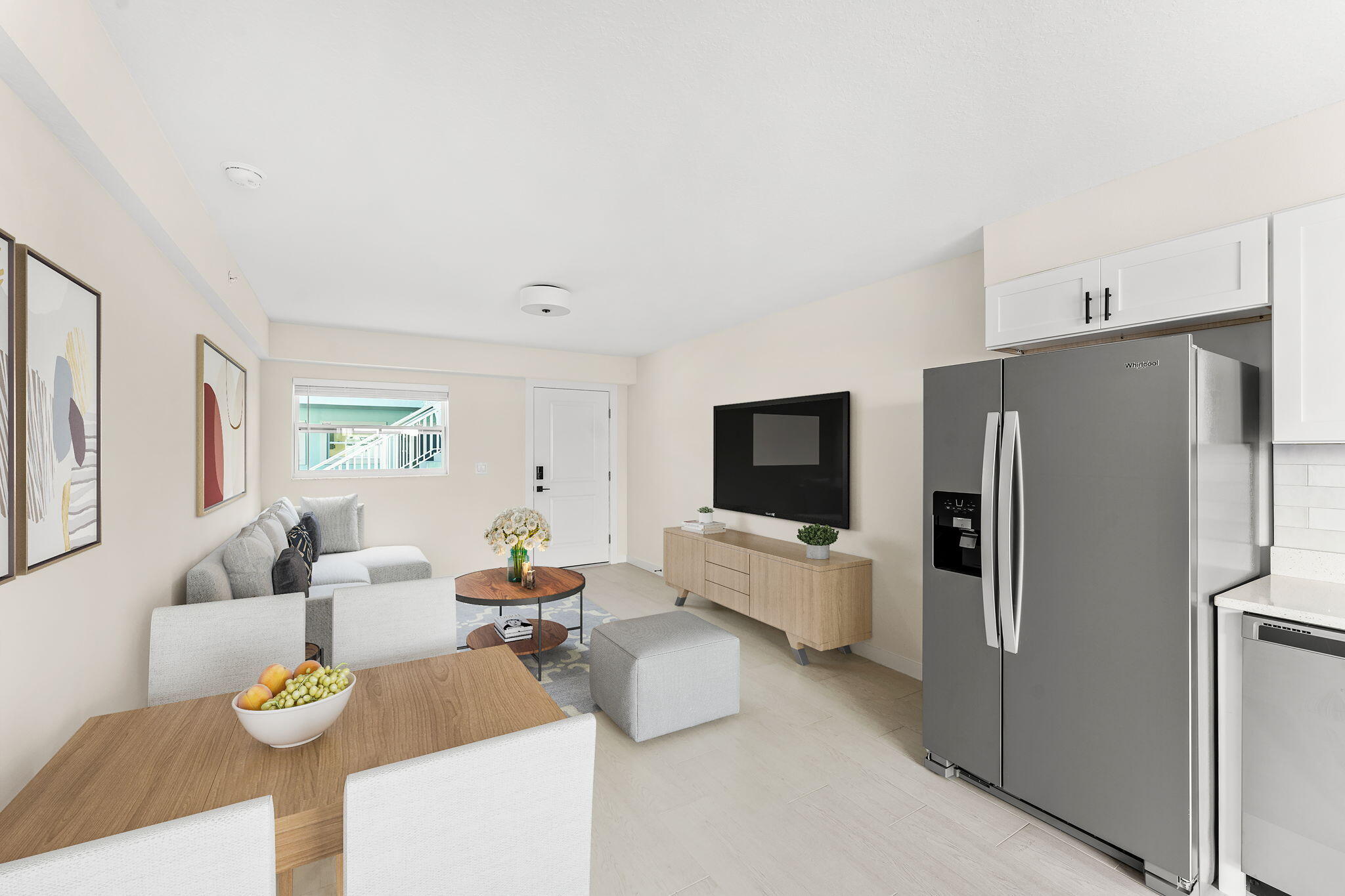 120 Central Road, Unit 212 Indian Harbour Beach, FL 32937 - Photo 3 of 12 a living room with furniture and a flat screen tv