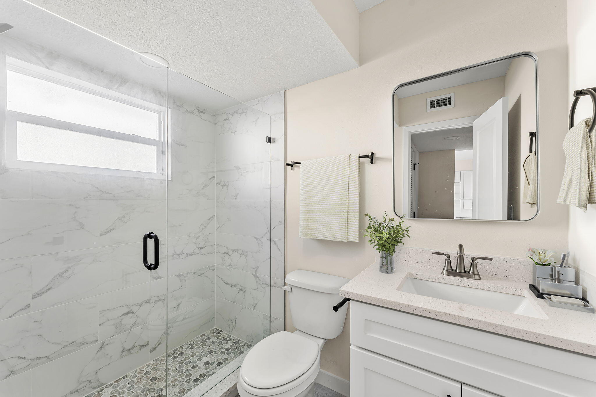 120 Central Road, Unit 212 Indian Harbour Beach, FL 32937 - Photo 6 of 12 a bathroom with a sink a toilet and shower