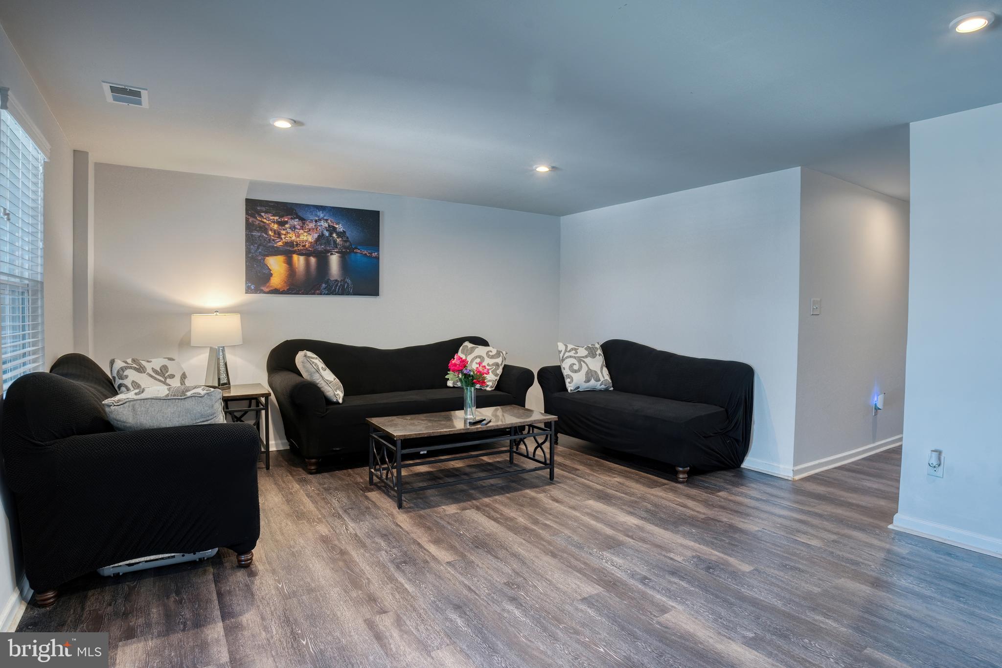 133 Spire Place Sewell, NJ 08080 - Photo 14 of 49 a living room with furniture and a wooden floor