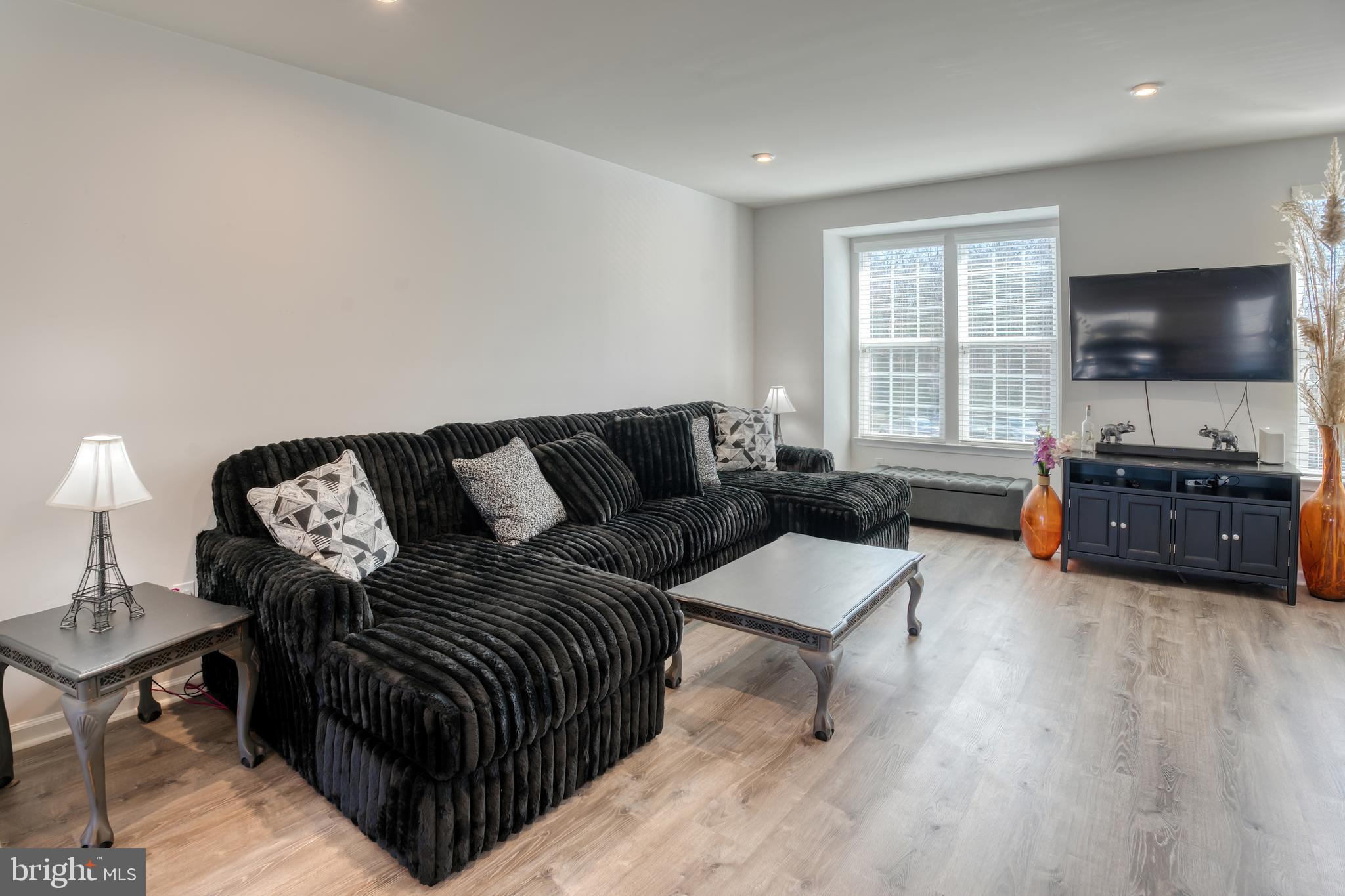 133 Spire Place Sewell, NJ 08080 - Photo 27 of 49 a living room with furniture and a flat screen tv