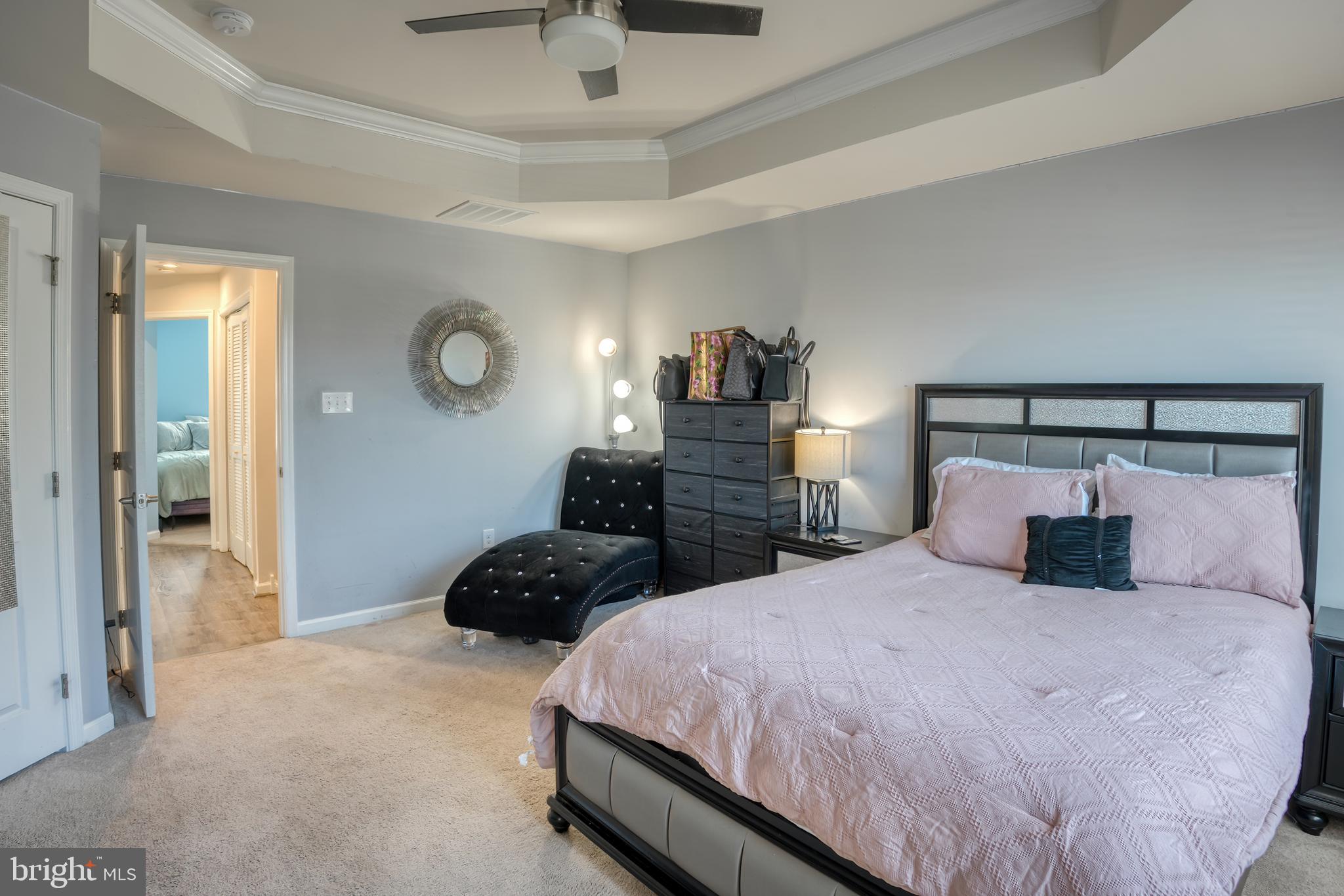 133 Spire Place Sewell, NJ 08080 - Photo 33 of 49 a bedroom with a bed and a lamp on dresser