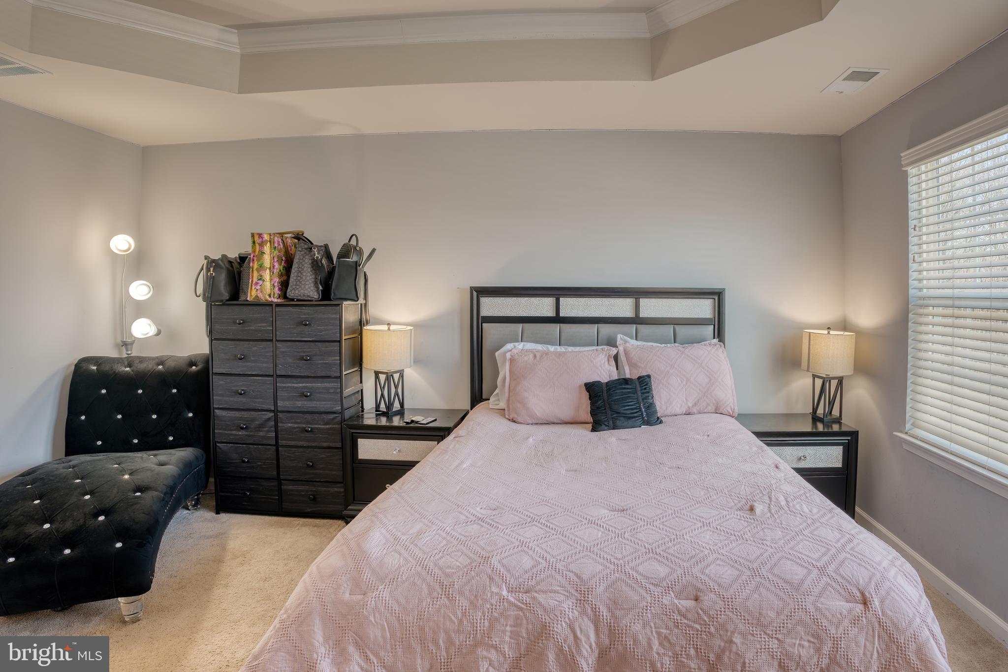 133 Spire Place Sewell, NJ 08080 - Photo 34 of 49 a bedroom with a bed and wooden floor