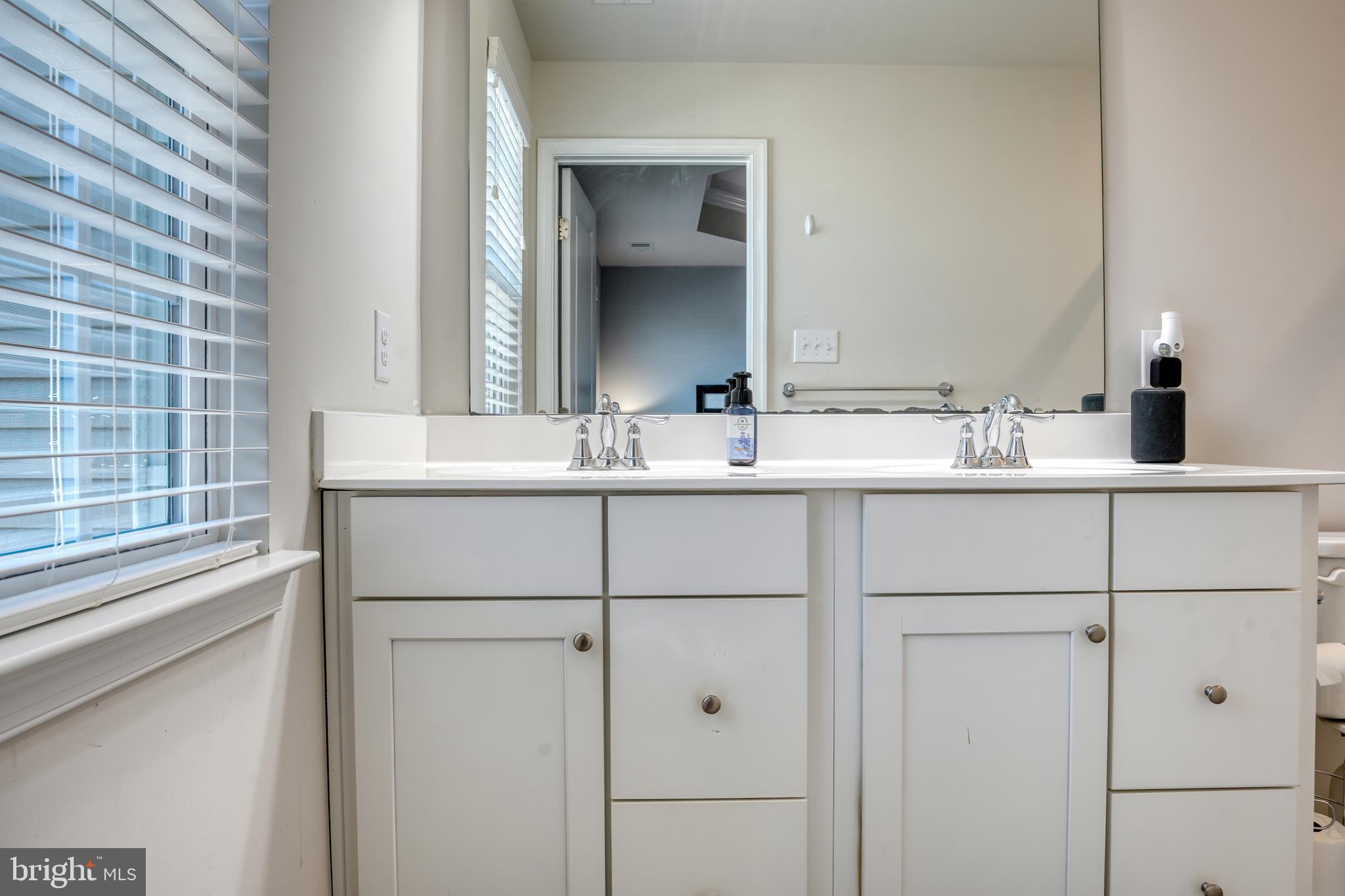 133 Spire Place Sewell, NJ 08080 - Photo 35 of 49 a bathroom with a double vanity sink and mirror