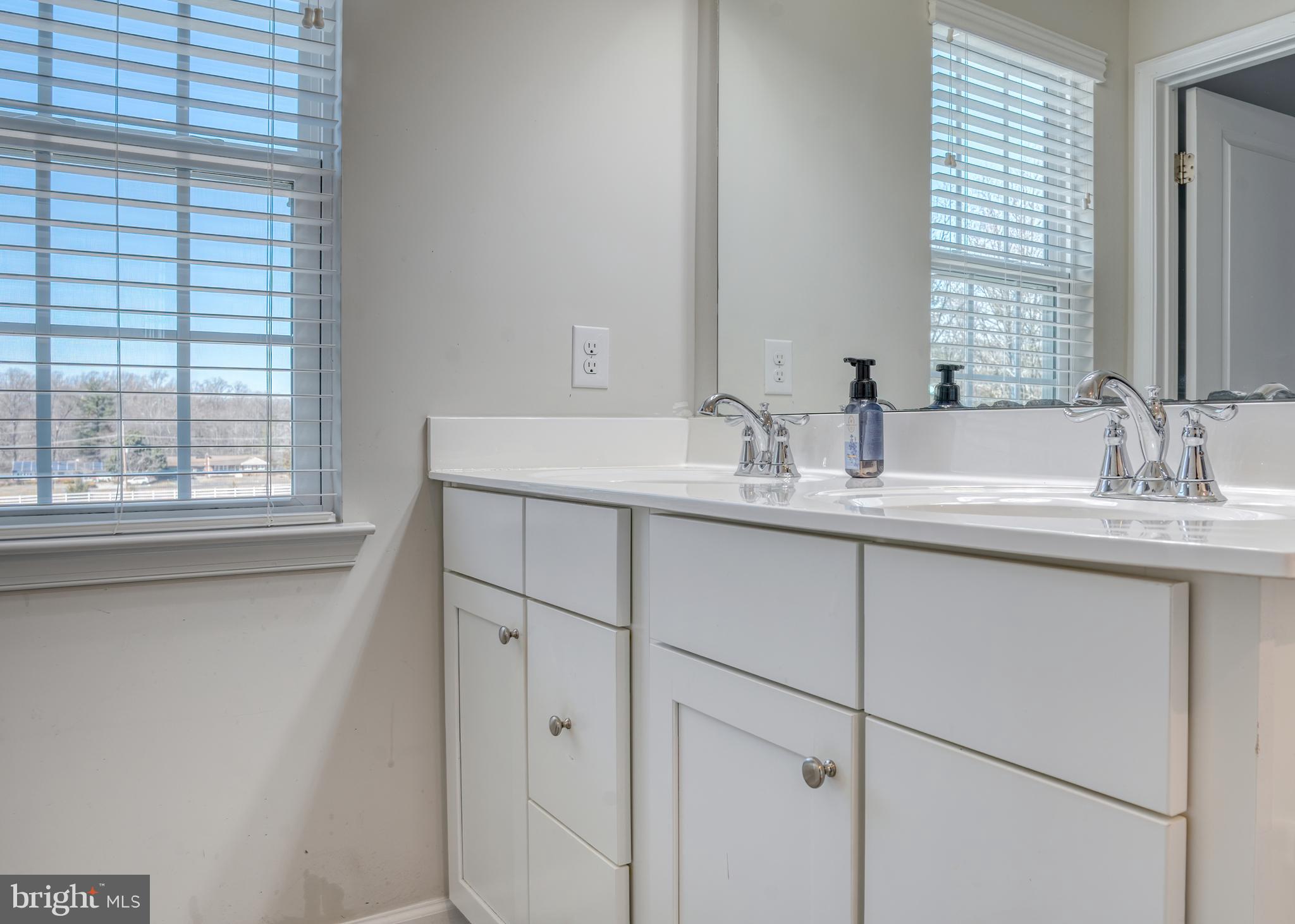 133 Spire Place Sewell, NJ 08080 - Photo 37 of 49 a bathroom with a granite countertop sink and a window