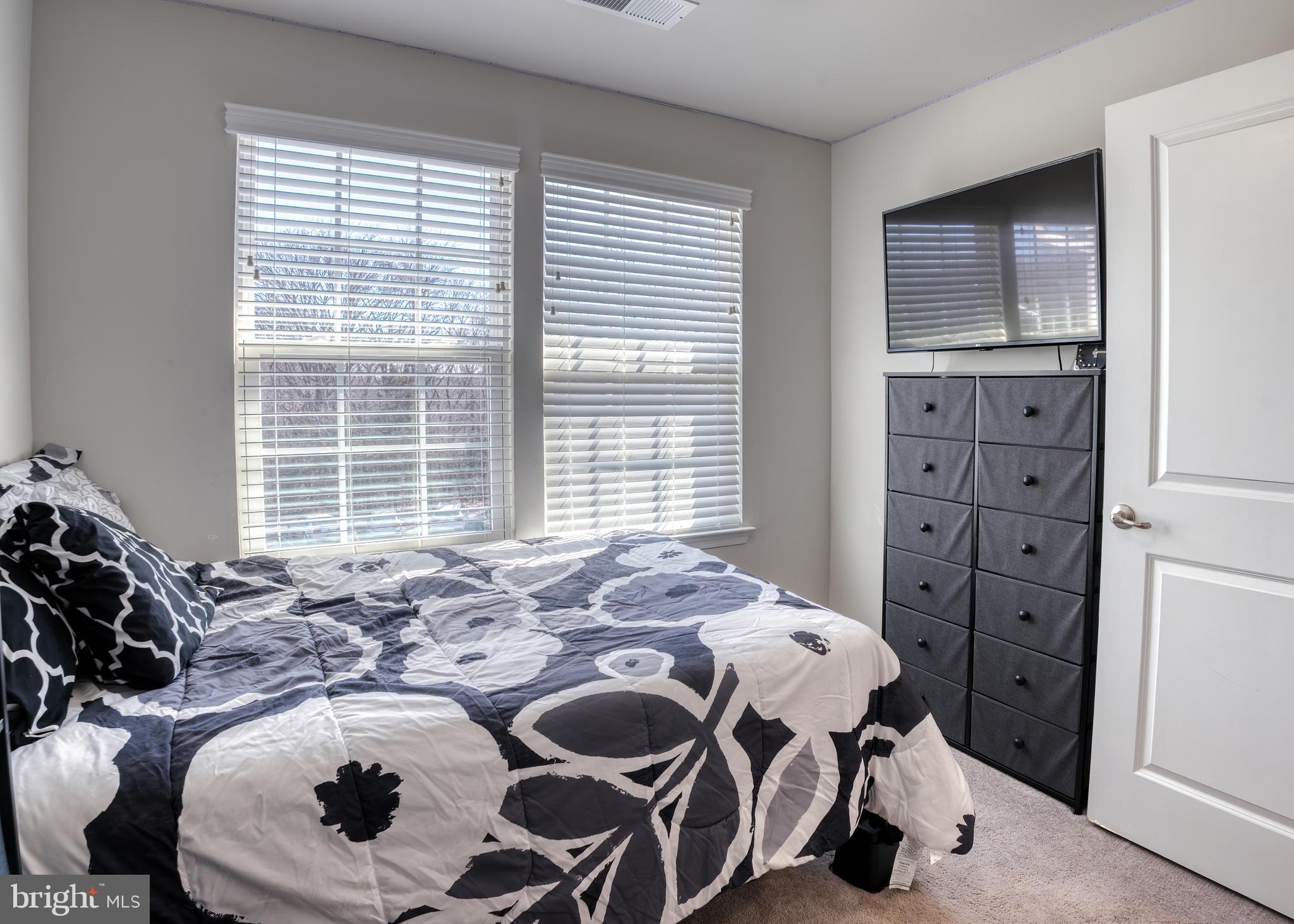 133 Spire Place Sewell, NJ 08080 - Photo 40 of 49 a bed sitting in a bedroom next to a window