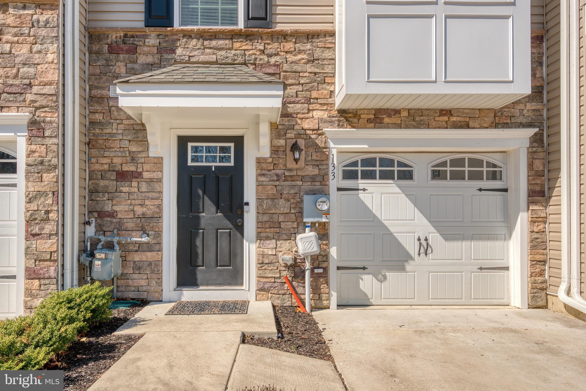 133 Spire Place Sewell, NJ 08080 - Photo 4 of 49 a front view of a house with a garden