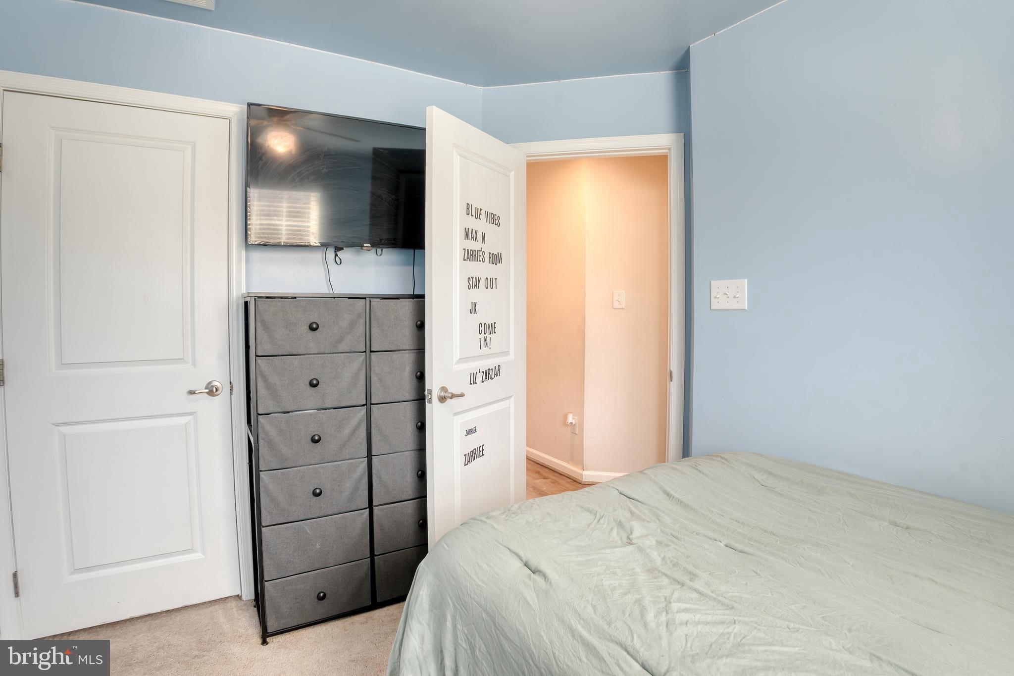 133 Spire Place Sewell, NJ 08080 - Photo 42 of 49 a bedroom with a bed and a flat tv screen in it