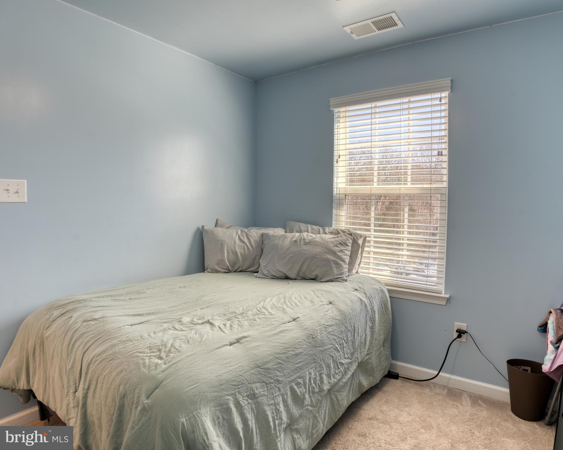 133 Spire Place Sewell, NJ 08080 - Photo 43 of 49 a large bed sitting in a bedroom next to a window