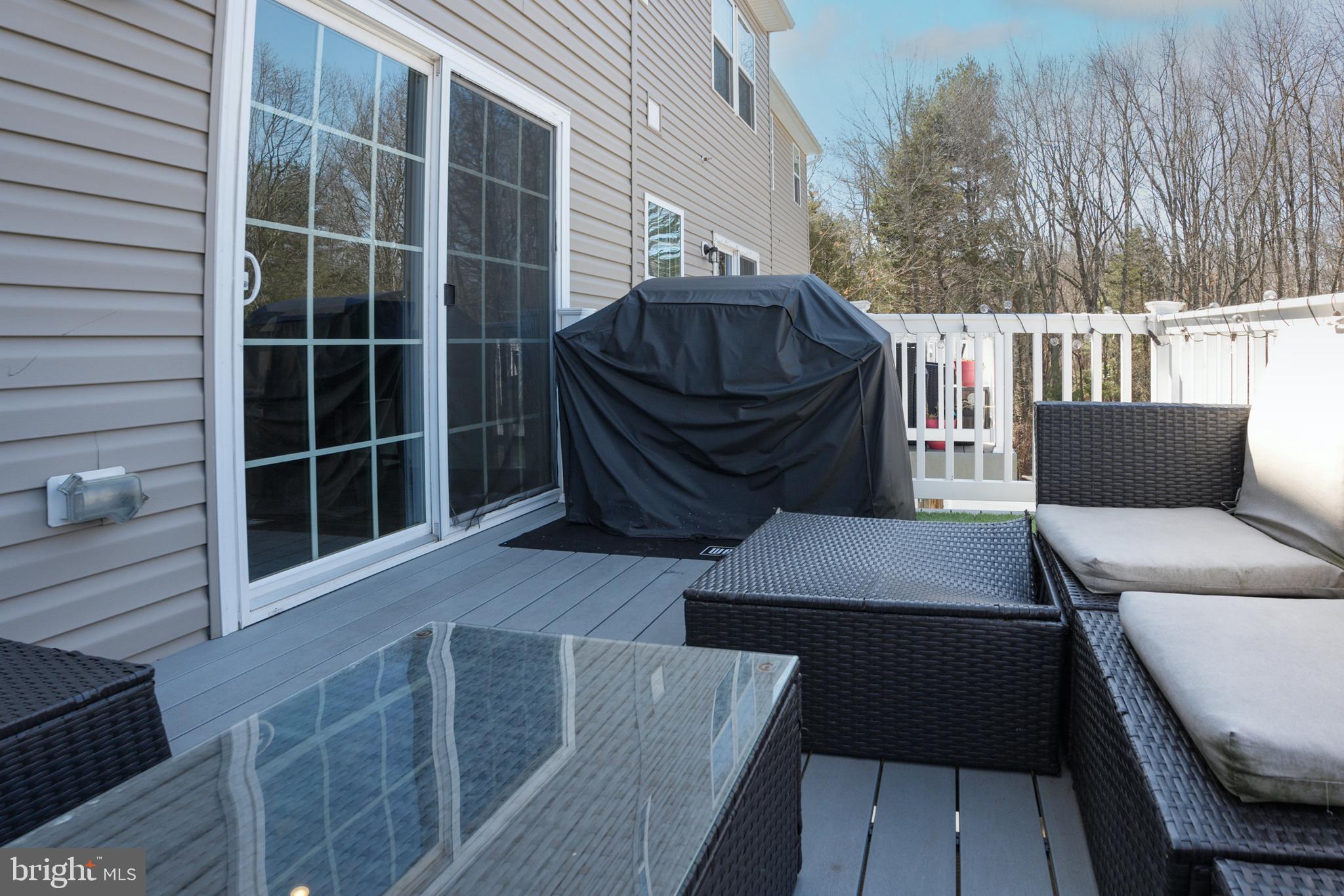 133 Spire Place Sewell, NJ 08080 - Photo 48 of 49 a balcony with table and chairs