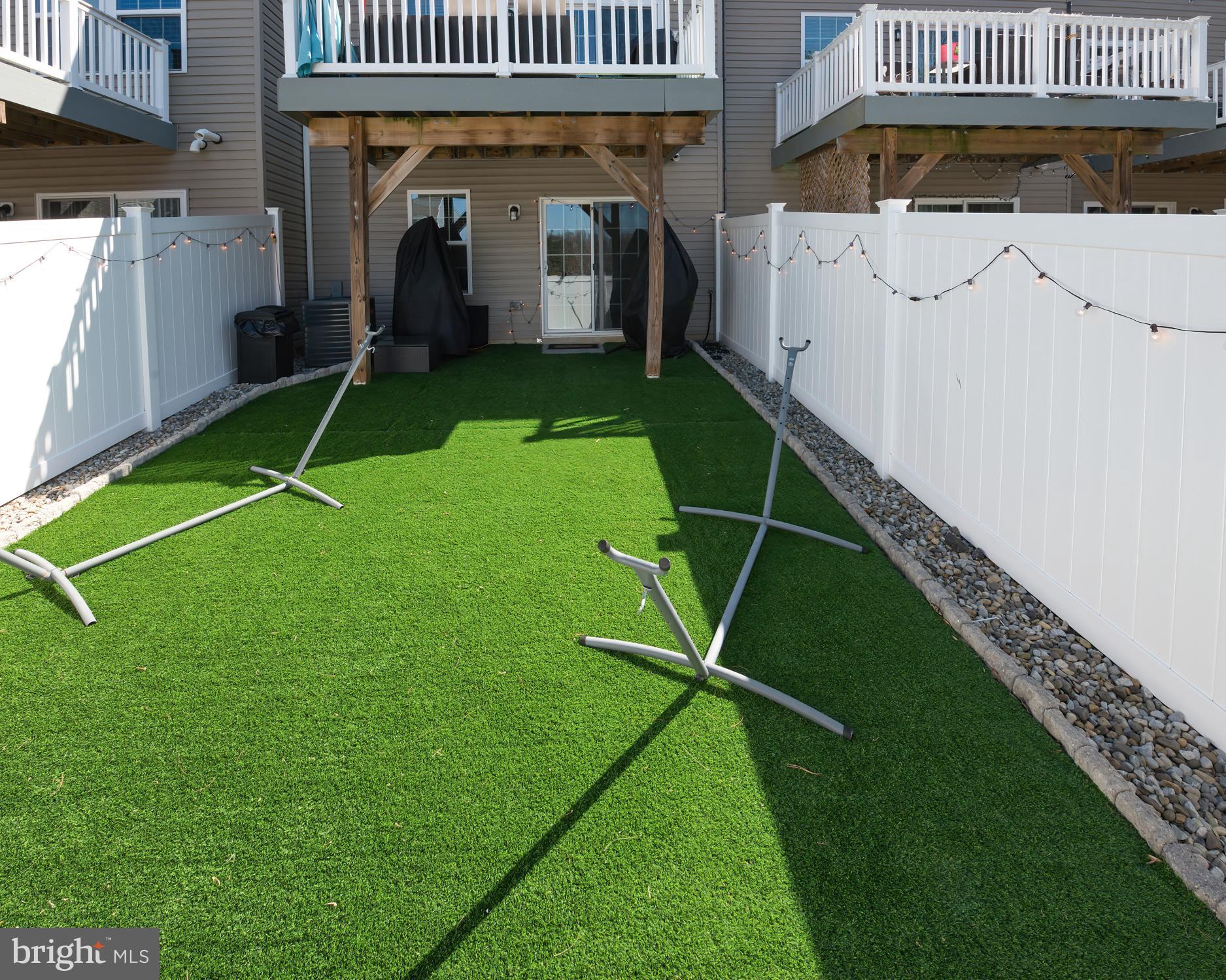 133 Spire Place Sewell, NJ 08080 - Photo 49 of 49 a backyard of a house with barbeque oven table and chairs
