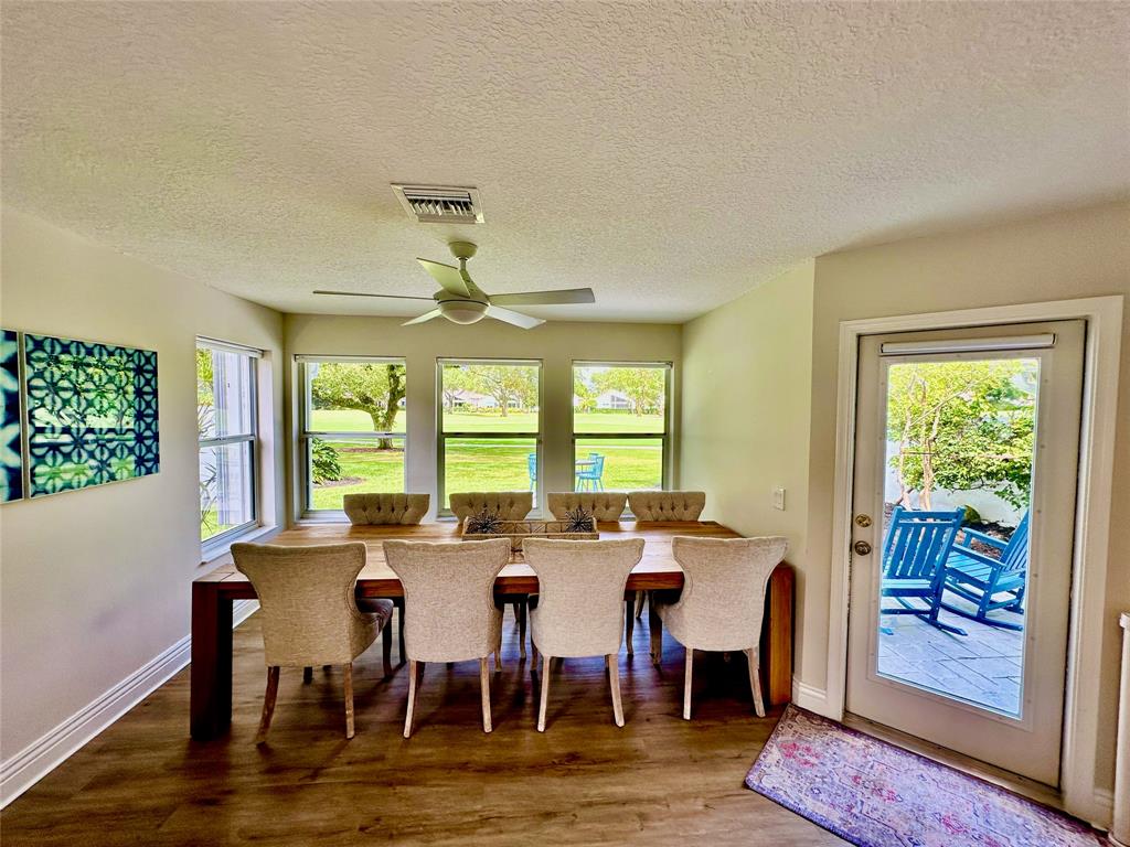 2295 Northwest 53rd Street Boca Raton, FL 33496 - Photo 14 of 89 a view of a dining room with furniture window and outside view