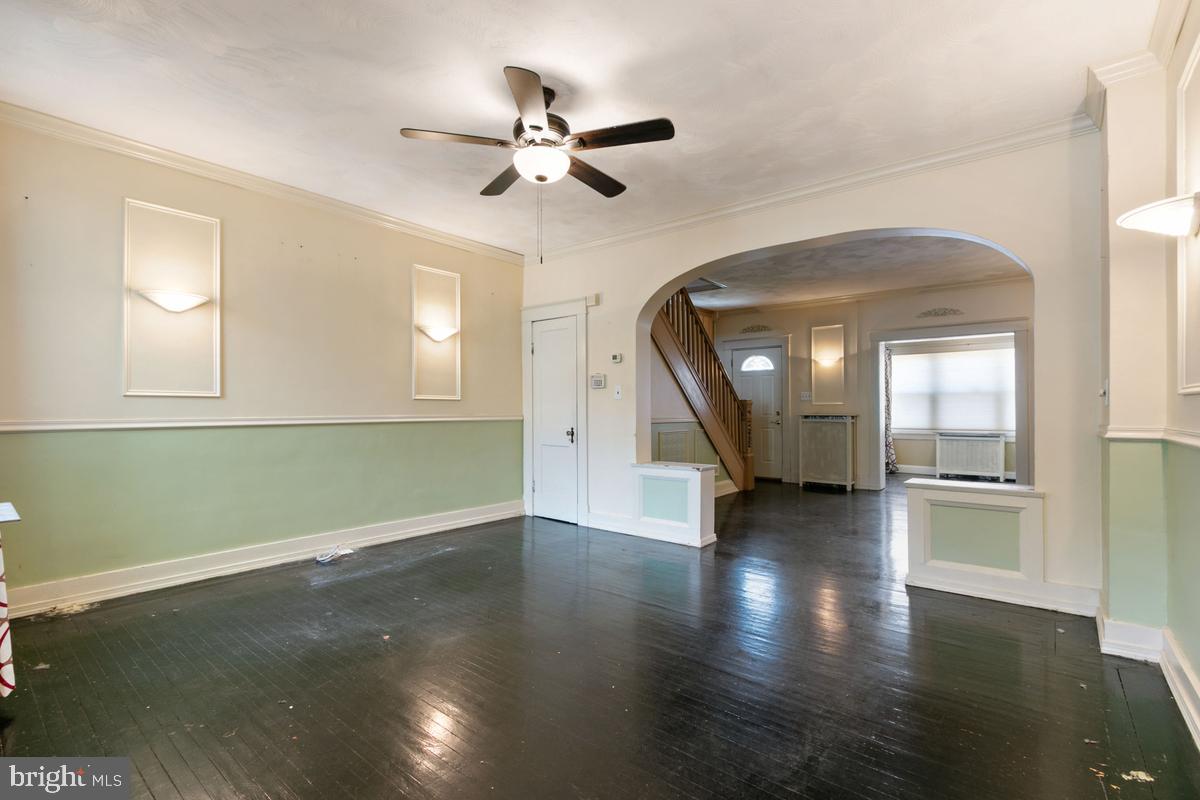 1745 Portship Road Dundalk, MD 21222 - Photo 11 of 44 a view of an empty room with wooden floor and a window