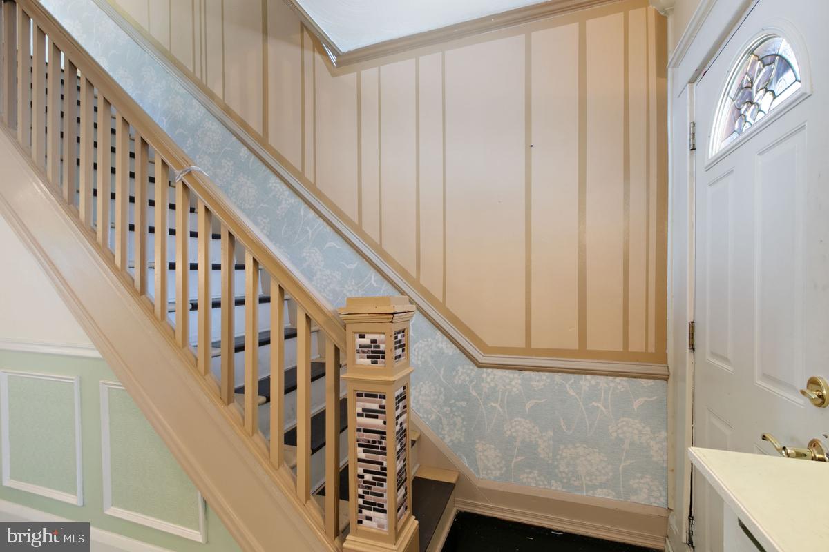 1745 Portship Road Dundalk, MD 21222 - Photo 17 of 44 a view of staircase with railing and white walls