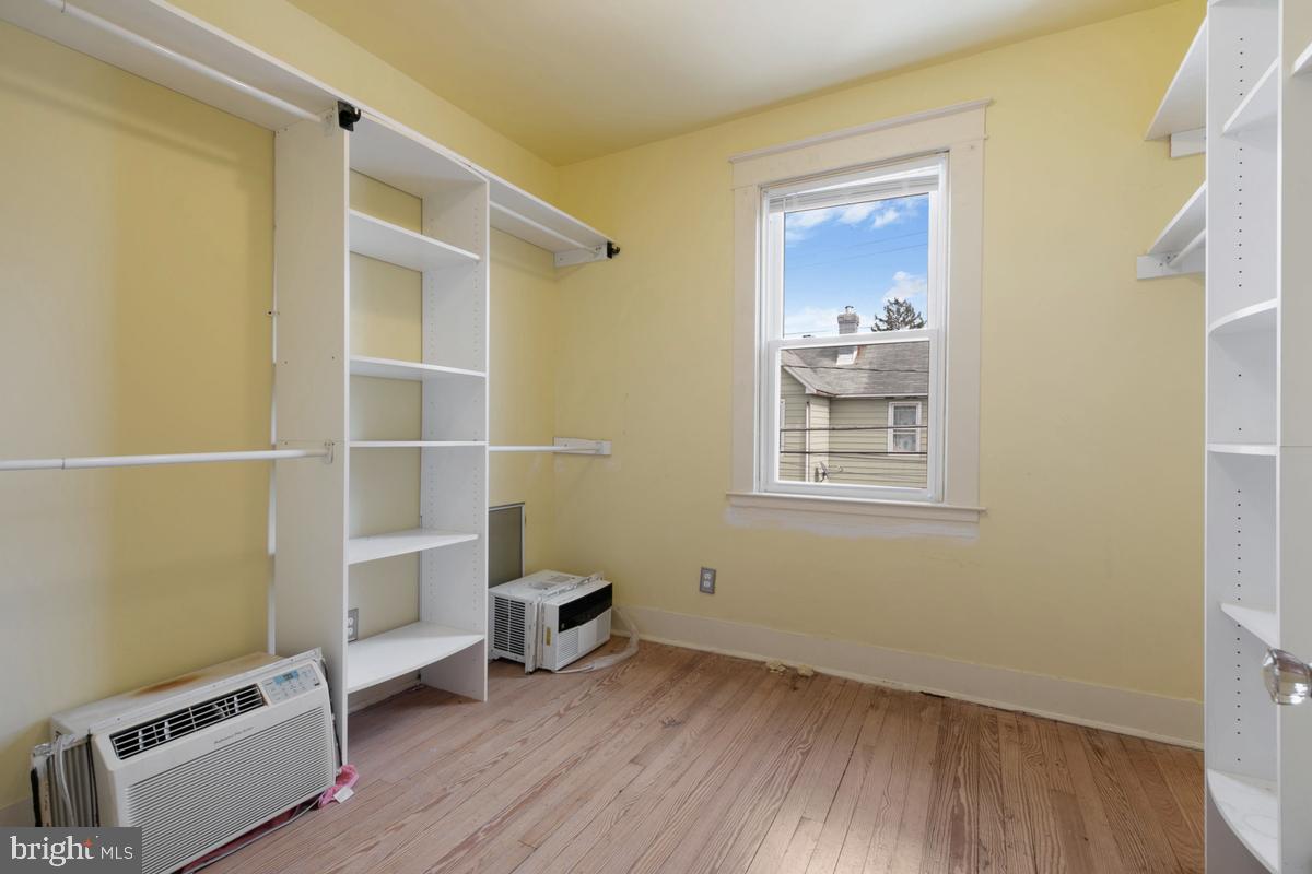 1745 Portship Road Dundalk, MD 21222 - Photo 23 of 44 a view of an empty room with wooden floor and a window