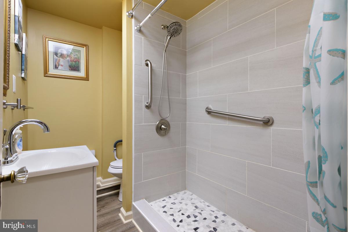 1745 Portship Road Dundalk, MD 21222 - Photo 25 of 44 a bathroom with a sink and a shower