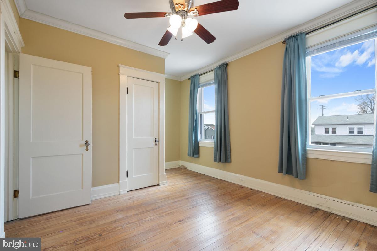 1745 Portship Road Dundalk, MD 21222 - Photo 30 of 44 a view of an empty room with window and wooden floor