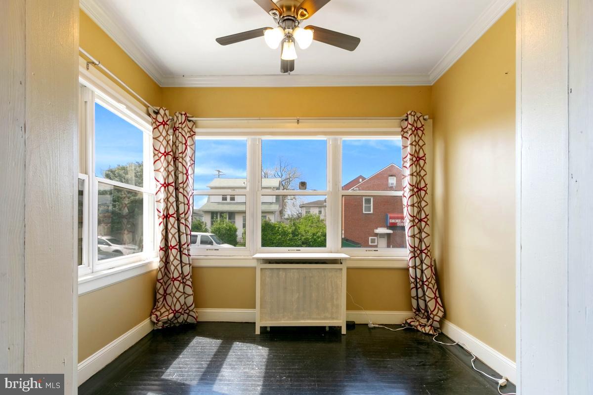 1745 Portship Road Dundalk, MD 21222 - Photo 7 of 44 a room with a window and wooden floor