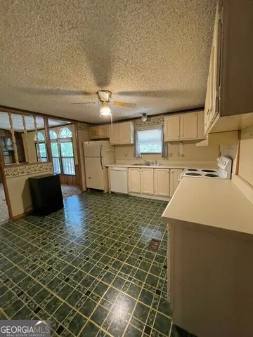 a kitchen that has a sink and a stove