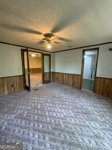 a view of a hallway with windows