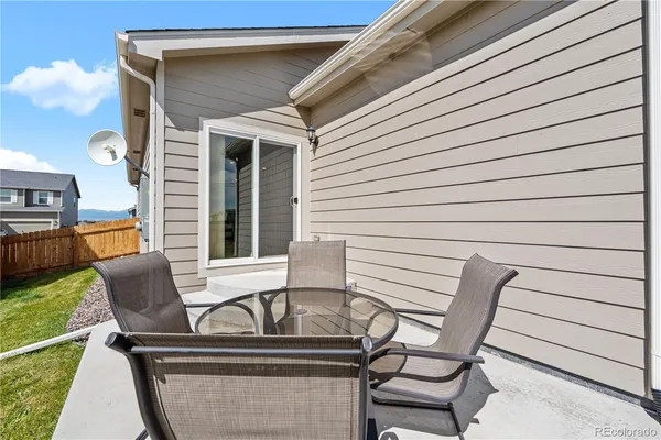 a view of backyard with seating space